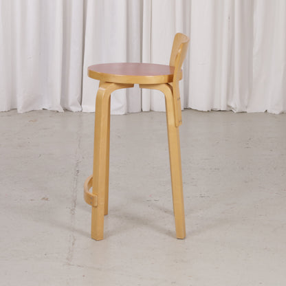 Alvar Aalto K65 high chair for Artek in patinated birch with a red linoleum seat