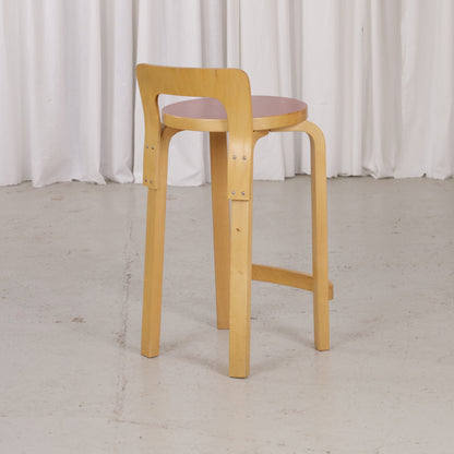 Alvar Aalto K65 high chair for Artek in patinated birch with a red linoleum seat