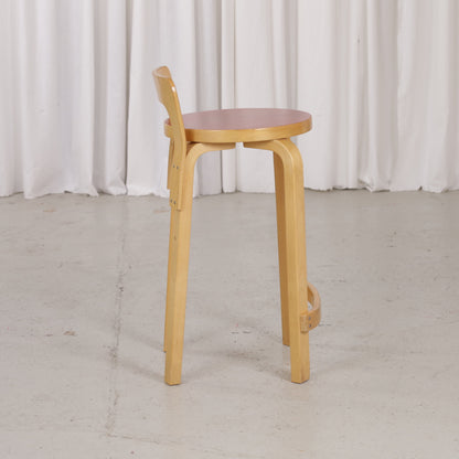 Alvar Aalto K65 high chair for Artek in patinated birch with a red linoleum seat