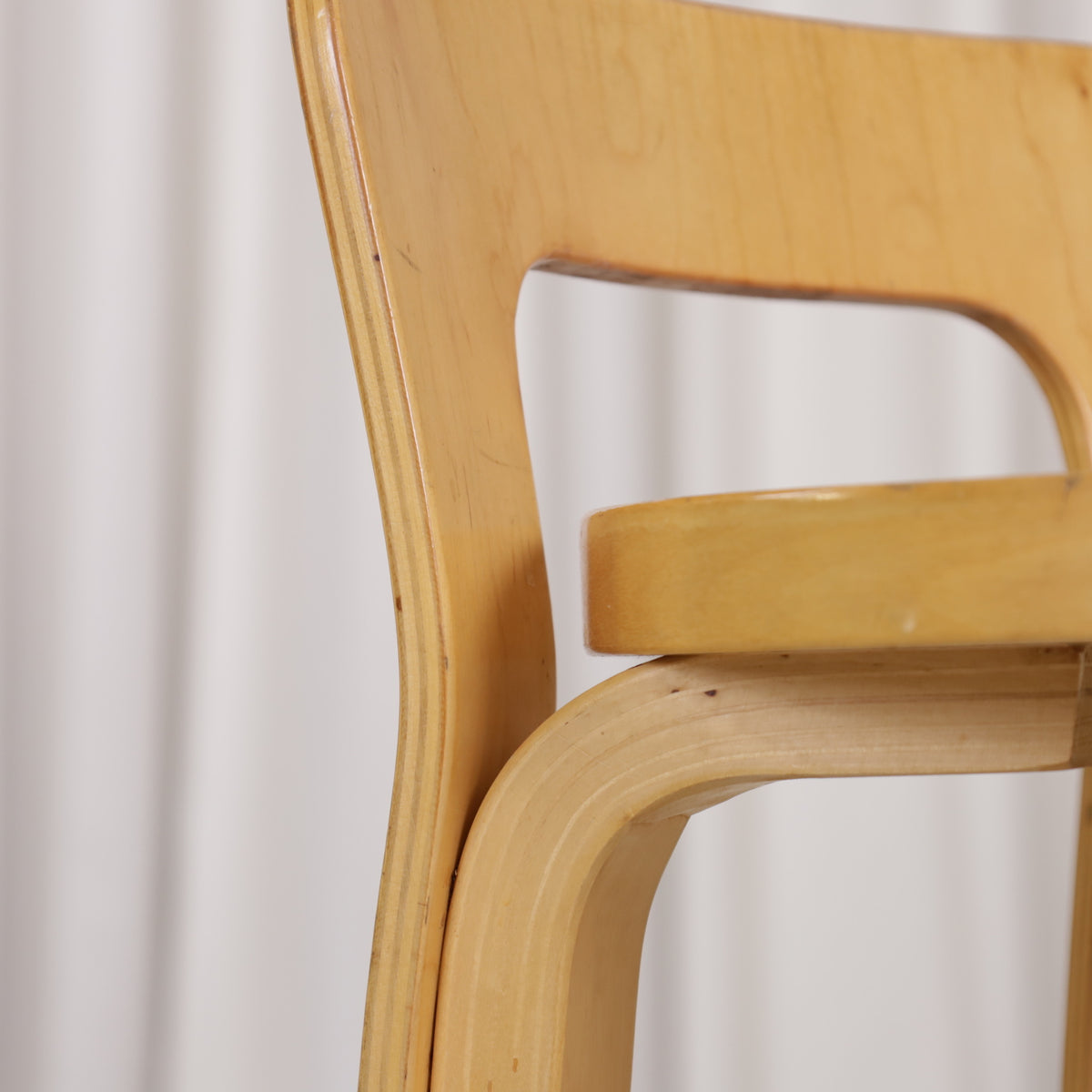 Alvar Aalto K65 high chair for Artek in patinated birch with a red linoleum seat