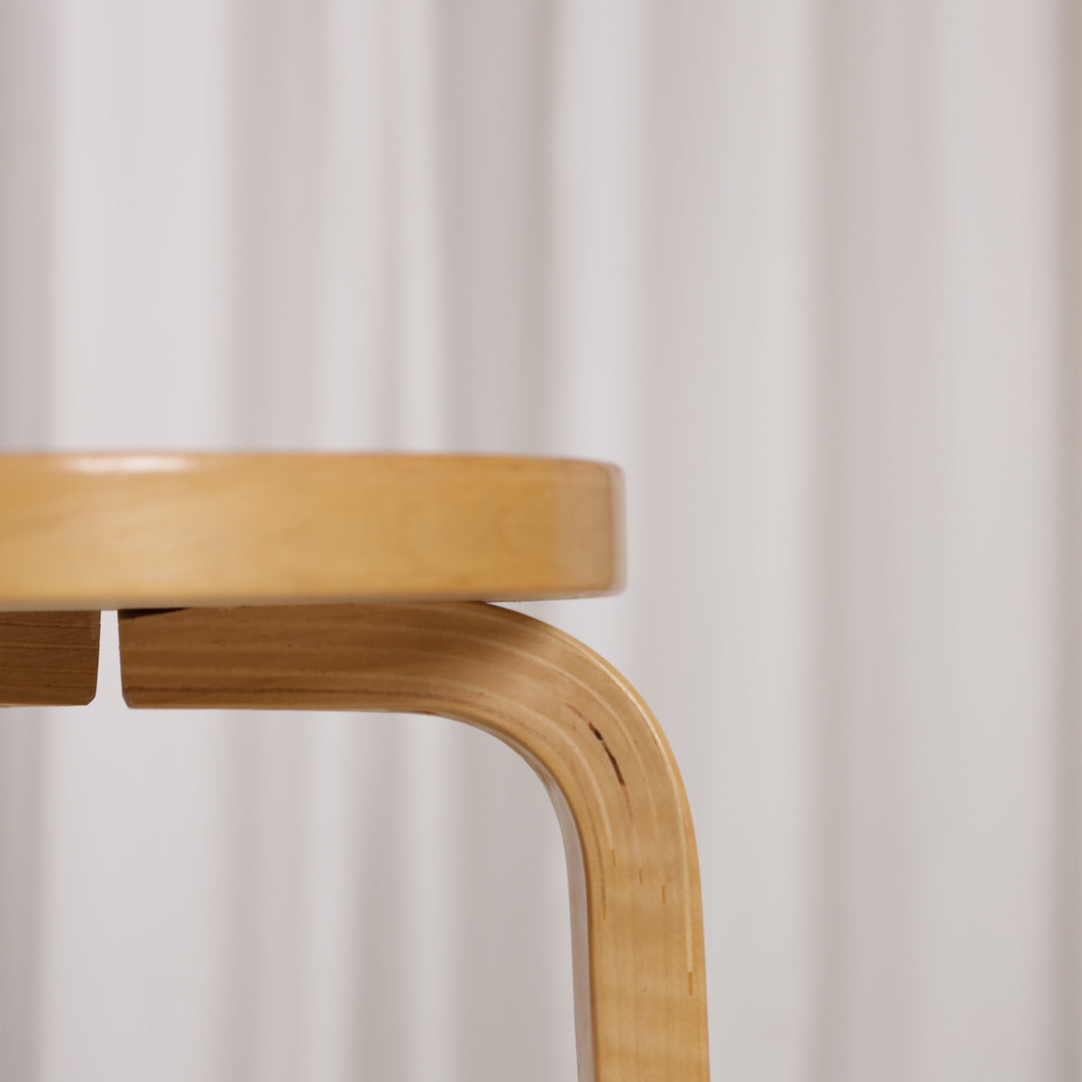 Alvar Aalto K65 high chair for Artek in patinated birch with a red linoleum seat