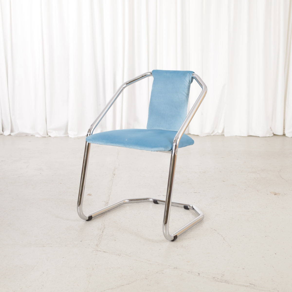 Italian-style chrome dining chair with blue upholstery — condition and details