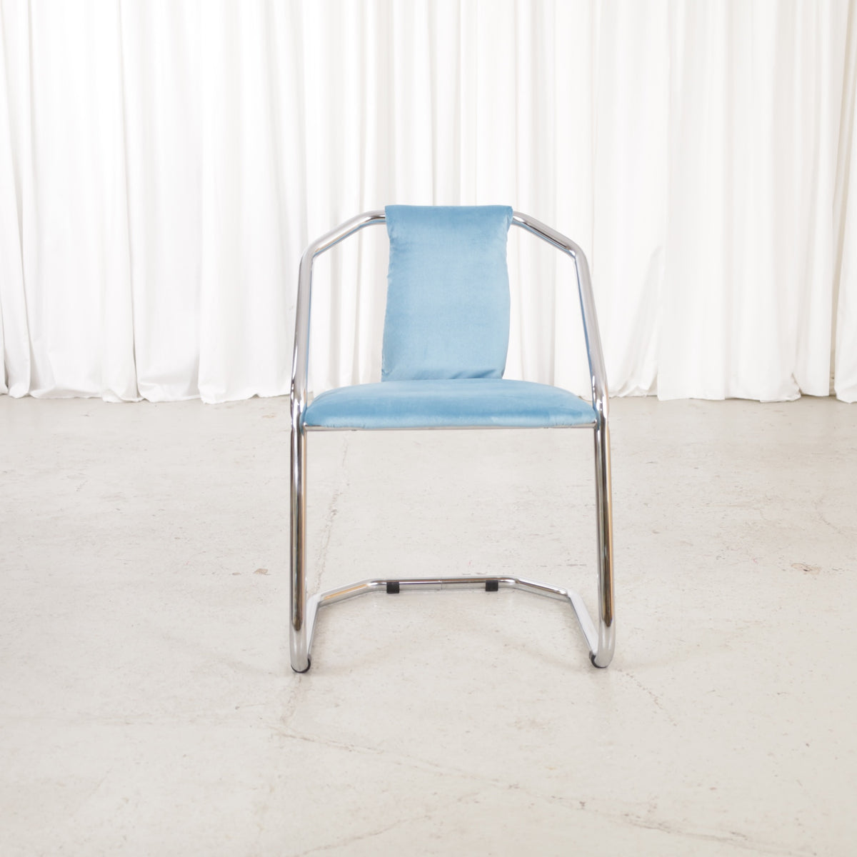 Italian-style chrome dining chair with blue upholstery — condition and details