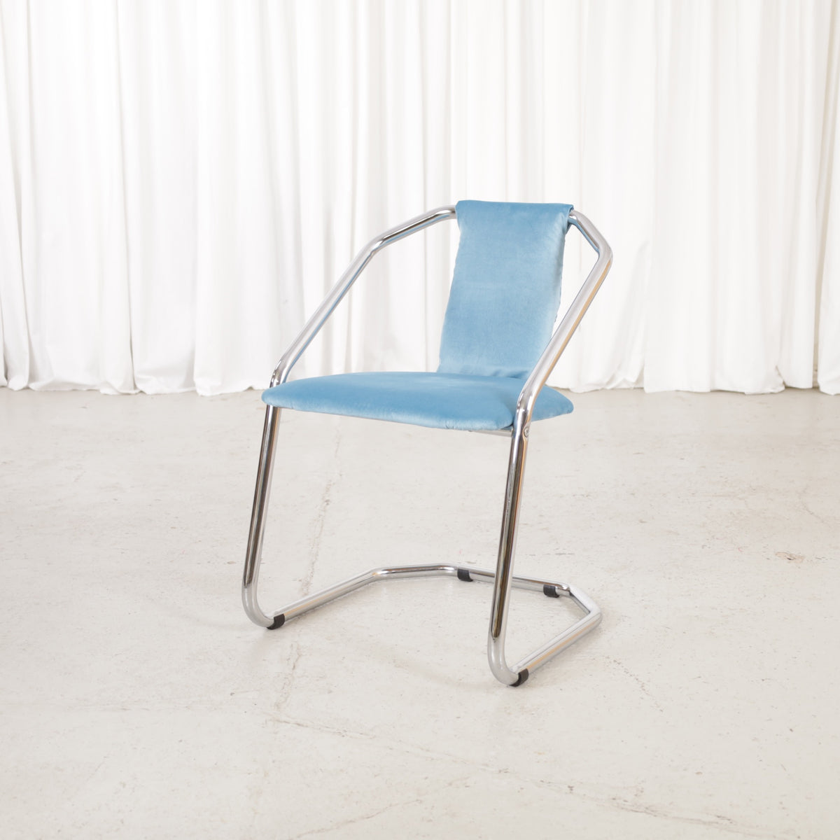 Italian-style chrome dining chair with blue upholstery — condition and details