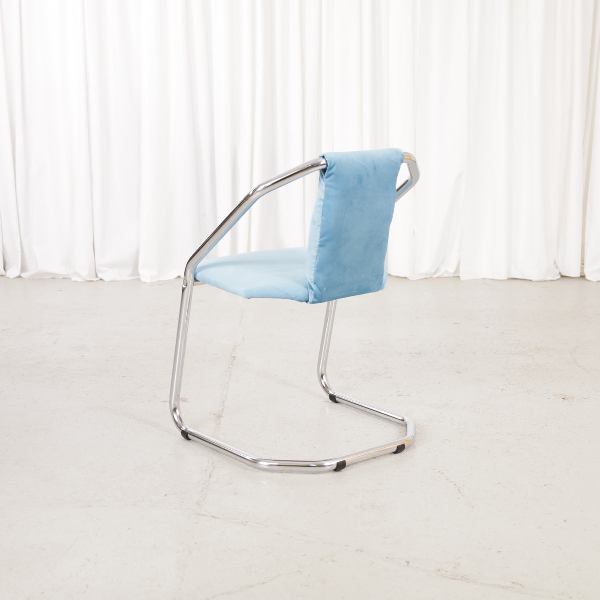 Italian-style chrome dining chair with blue upholstery — condition and details