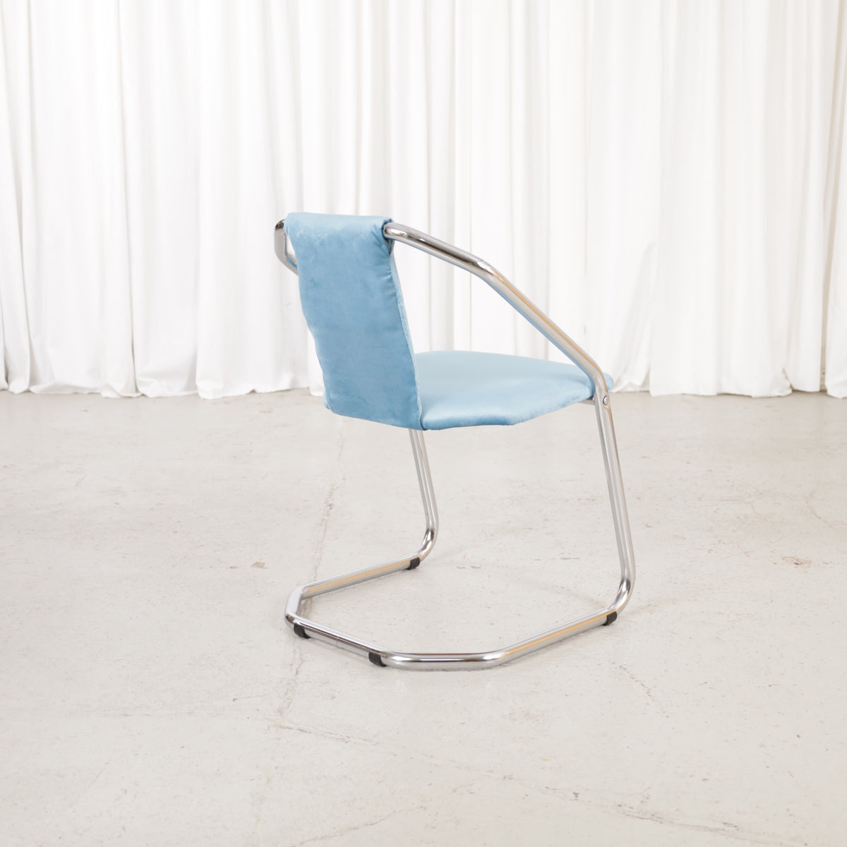 Italian-style chrome dining chair with blue upholstery — condition and details
