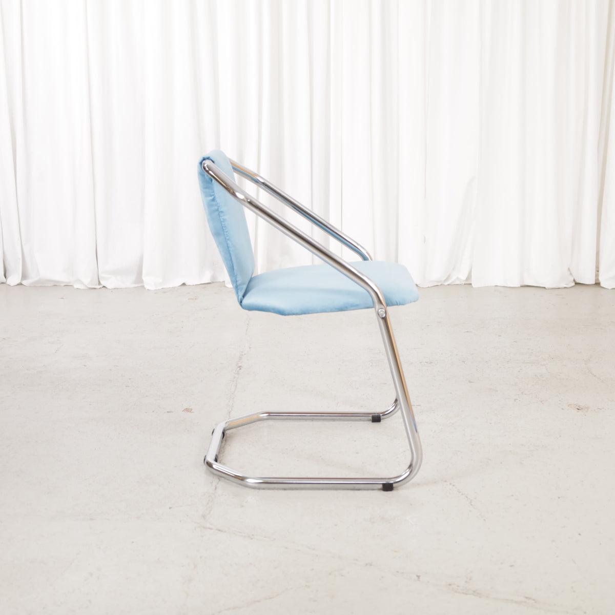 Italian-style chrome dining chair with blue upholstery — condition and details