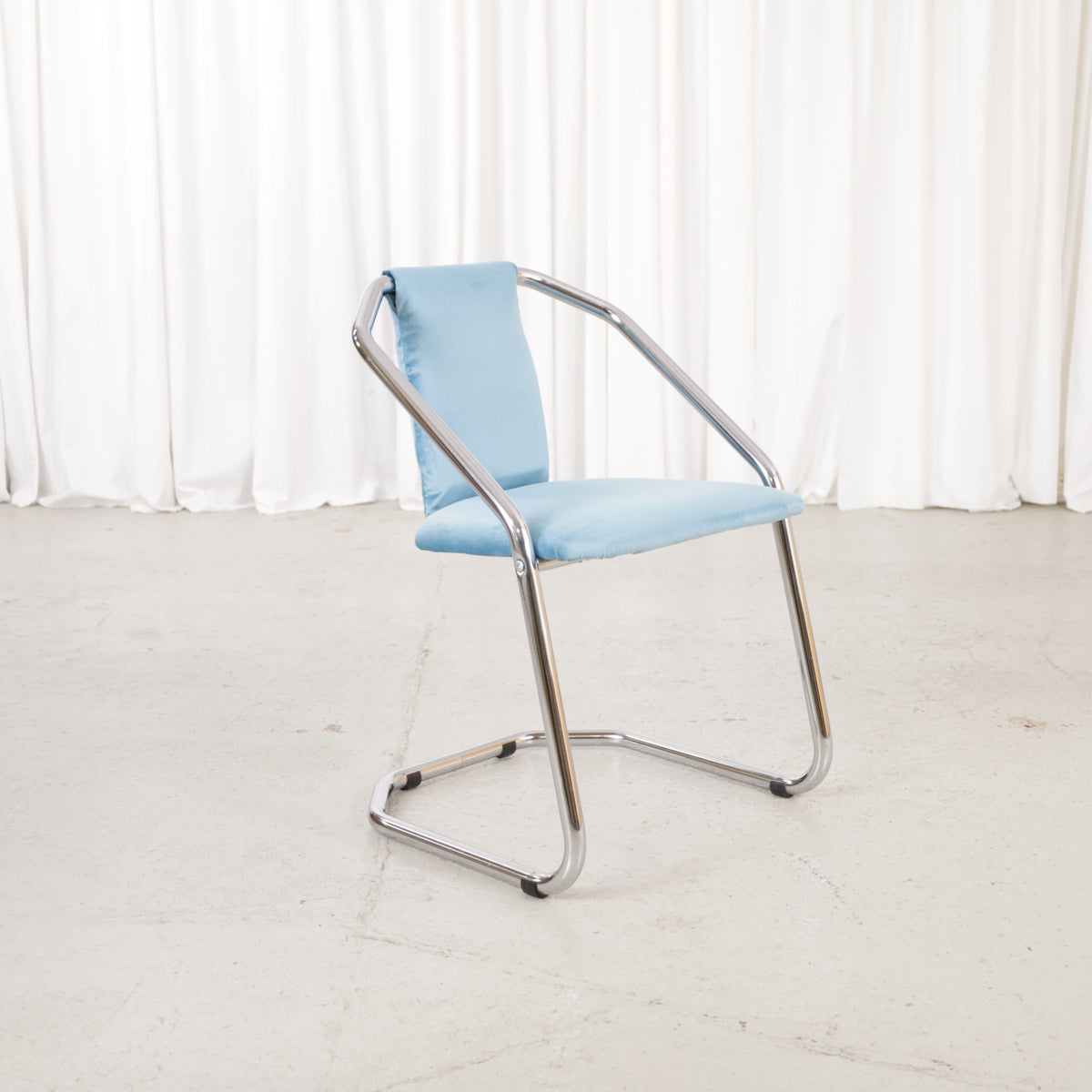 Italian-style chrome dining chair with blue upholstery — condition and details