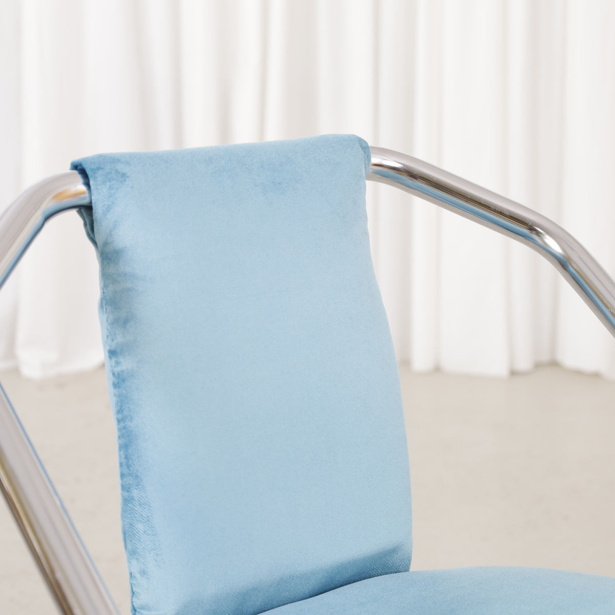 Italian-style chrome dining chair with blue upholstery — condition and details