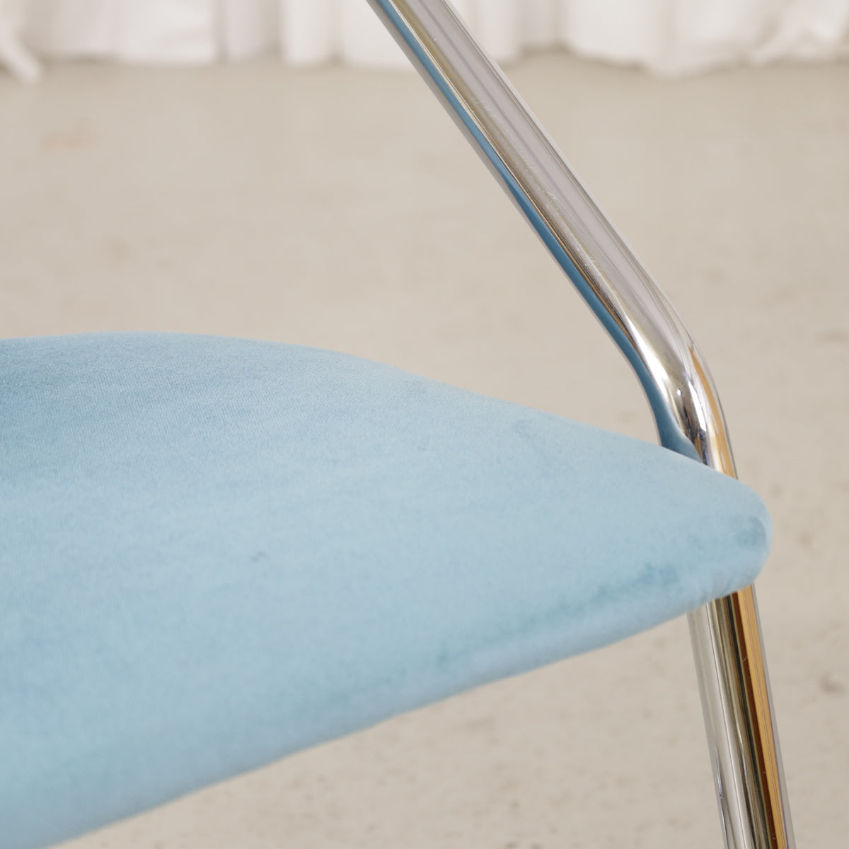 Italian-style chrome dining chair with blue upholstery — condition and details