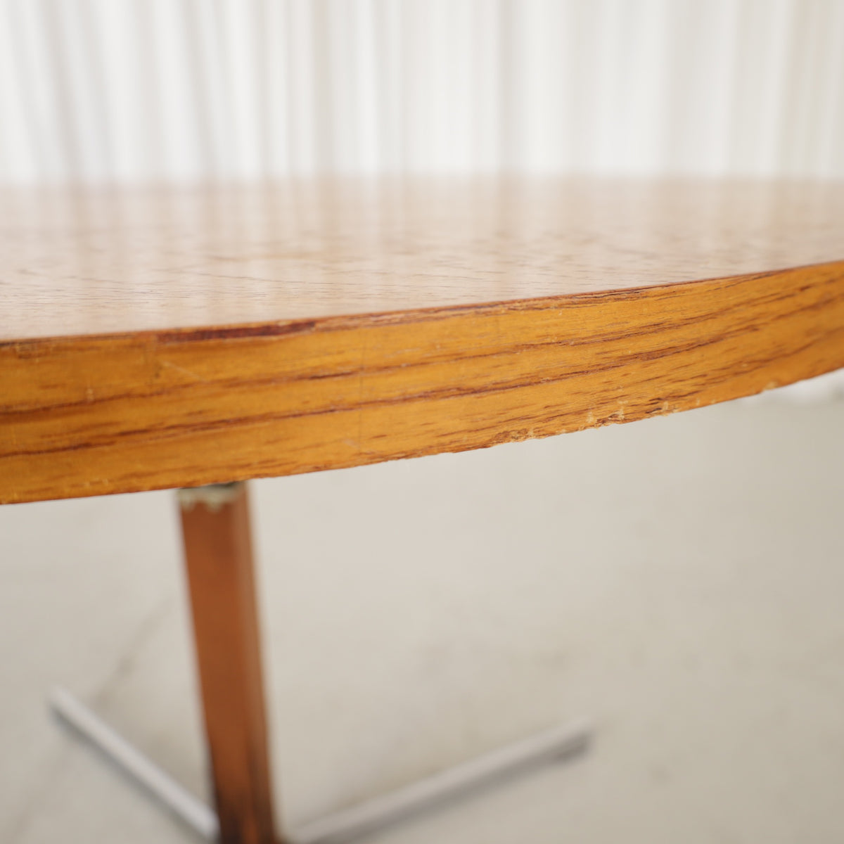 Vintage height-adjustable table with teak top and chrome base — surface, base or mechanism detail