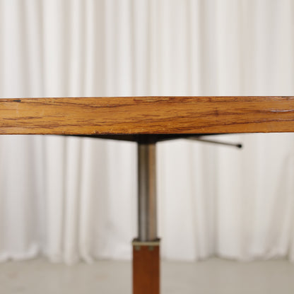 Vintage height-adjustable table with teak top and chrome base — surface, base or mechanism detail