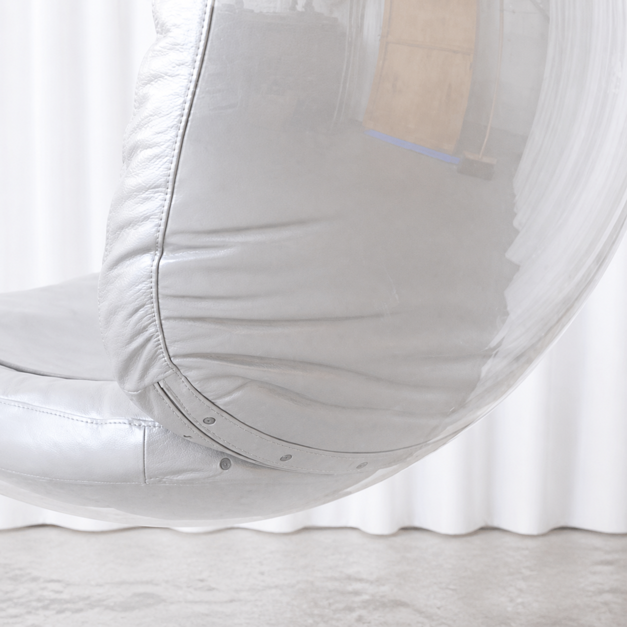 Rear upholstery and clear acrylic shell detail of Eero Aarnio Bubble Chair