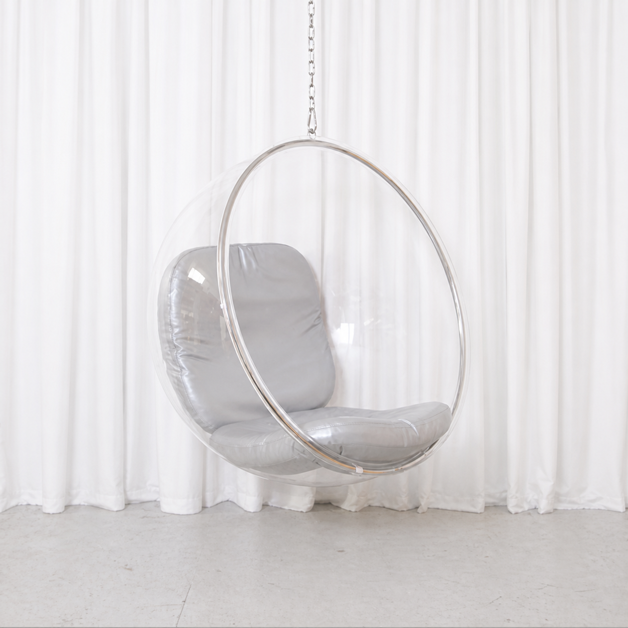 Eero Aarnio Bubble Chair with clear acrylic shell and silver leather cushions