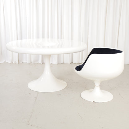 White Eero Aarnio Kanttarelli dining table for Asko, styled with a chair that is not included