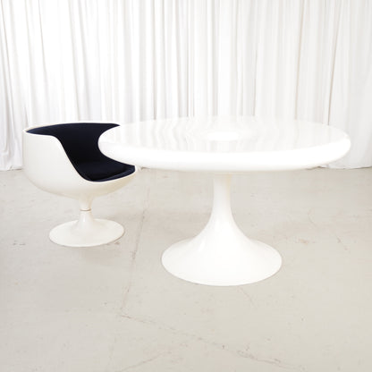 White Eero Aarnio Kanttarelli dining table for Asko, styled with a chair that is not included