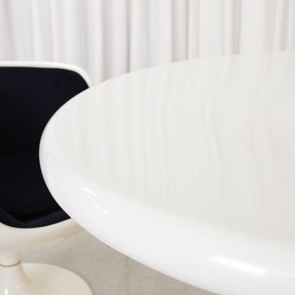 White Eero Aarnio Kanttarelli dining table for Asko, styled with a chair that is not included