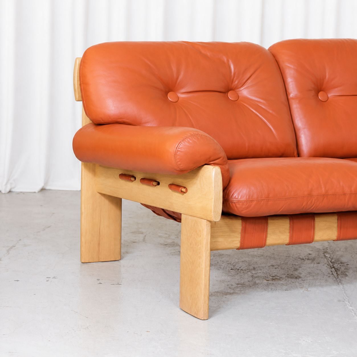 Africa sofa cognac leather upholstery and oak arm detail