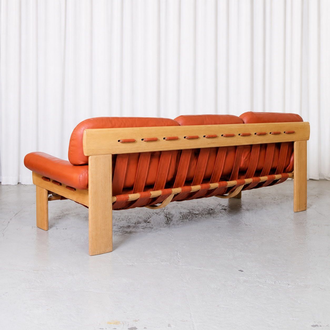 Esko Pajamies Africa three-seat sofa with oak frame and leather straps, rear view
