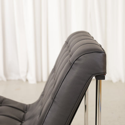 ICF New York lounge chair in black leather, buttoned leather and frame detail