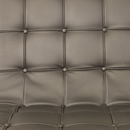 ICF New York lounge chair in black leather, buttoned leather and frame detail