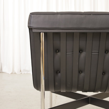 ICF New York lounge chair in black leather, buttoned leather and frame detail