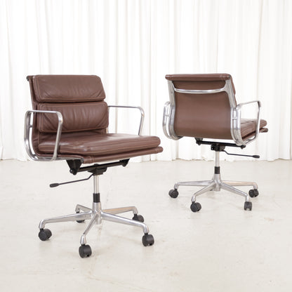 Two brown leather ICF Soft Pad office chairs with castors