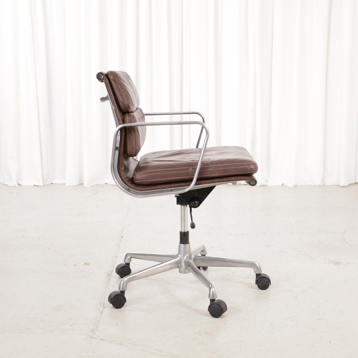 Side view of the brown leather Soft Pad chair