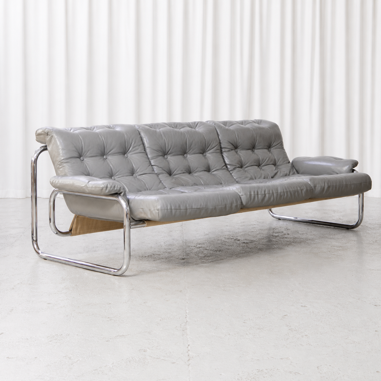 Grey leather IKEA Borkum three-seater sofa, front three-quarter view