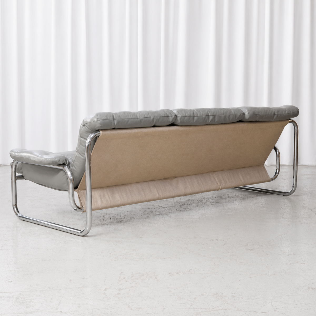 IKEA Borkum sofa from the rear, showing the supporting canvas and chrome frame