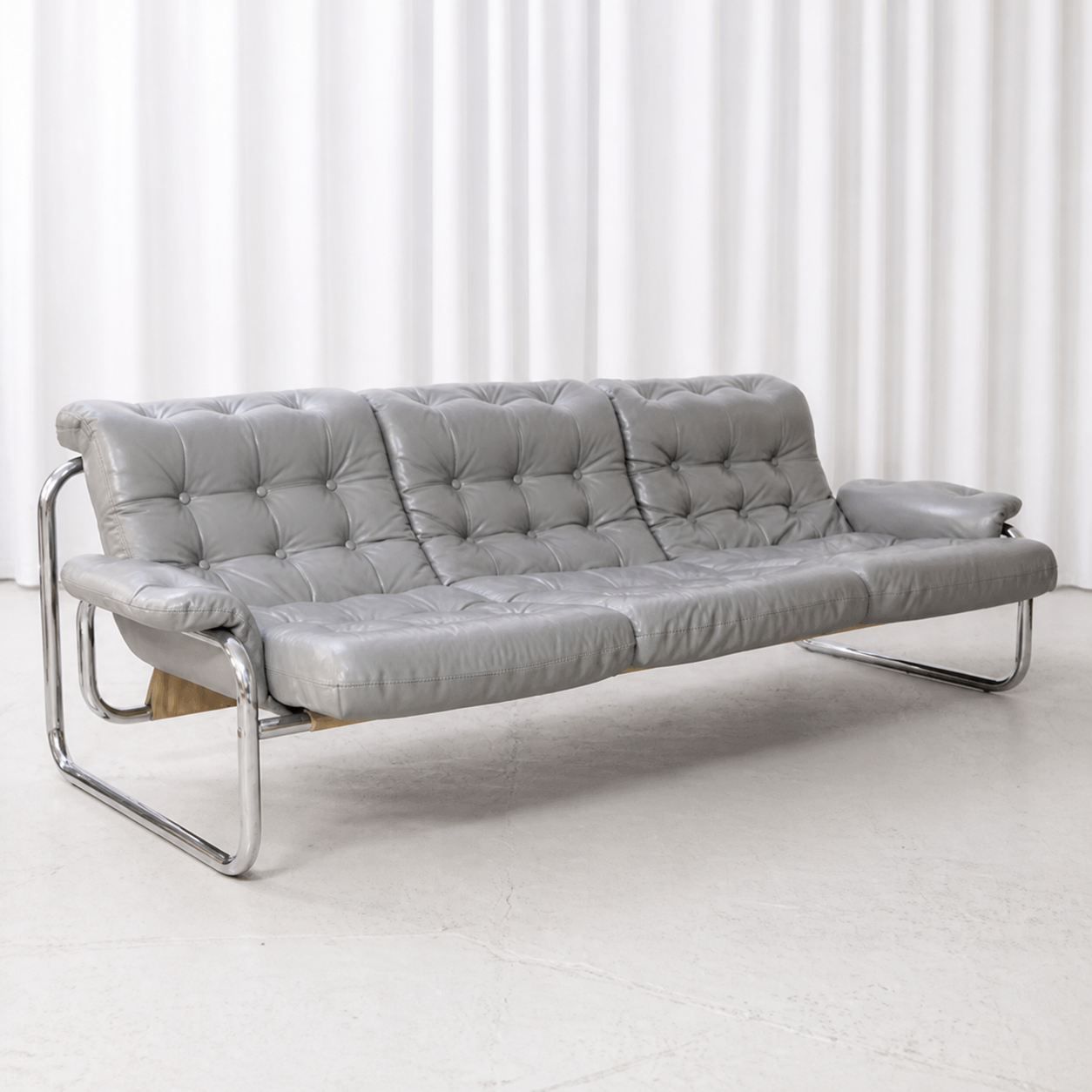 Grey leather IKEA Borkum three-seater sofa, left three-quarter view