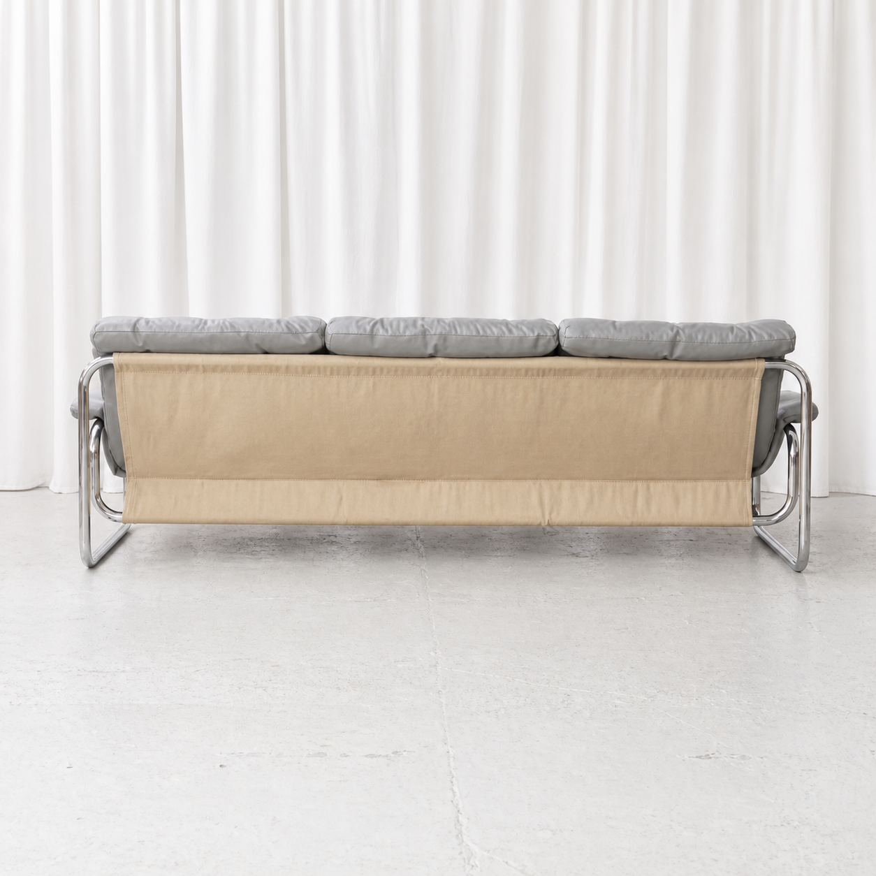 Full rear view of IKEA Borkum sofa with beige supporting canvas