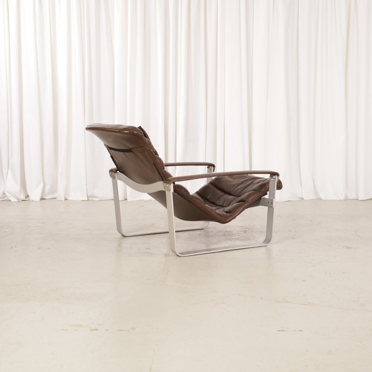 Ilmari Lappalainen Pulkka Lounge Chair in Brown Leather for Asko, rear view of Ilmari Lappalainen Pulkka lounge chair