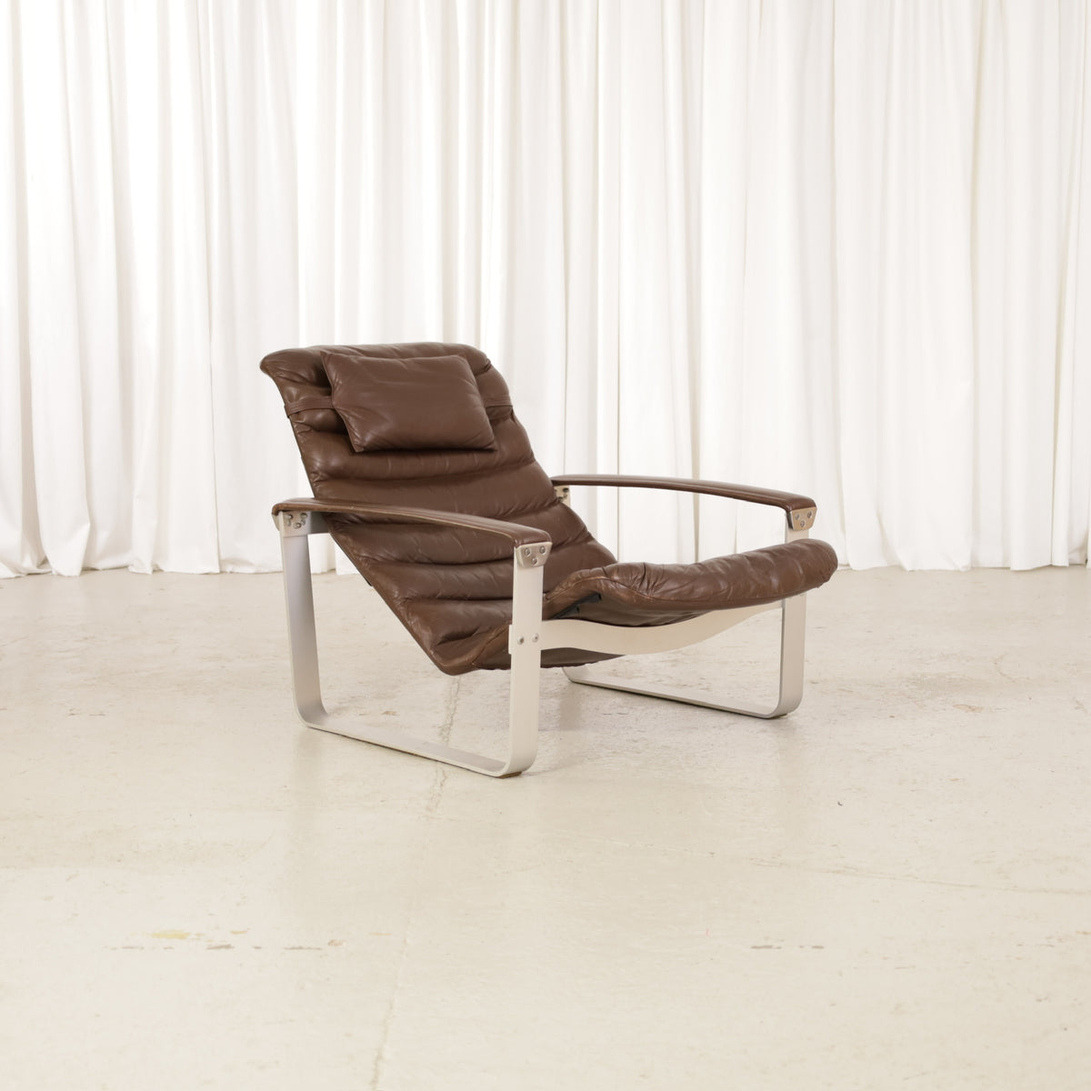 Ilmari Lappalainen Pulkka Lounge Chair in Brown Leather for Asko, front view of Ilmari Lappalainen Pulkka lounge chair