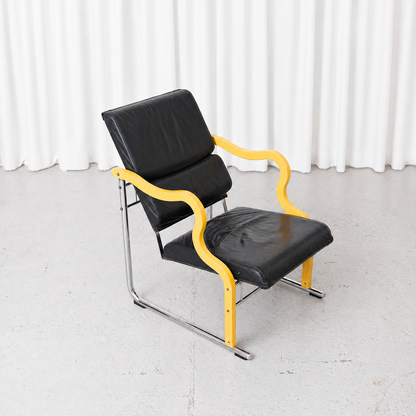 Yrjö Kukkapuro Experiment Lounge Chair in Black Leather and Yellow Armrests