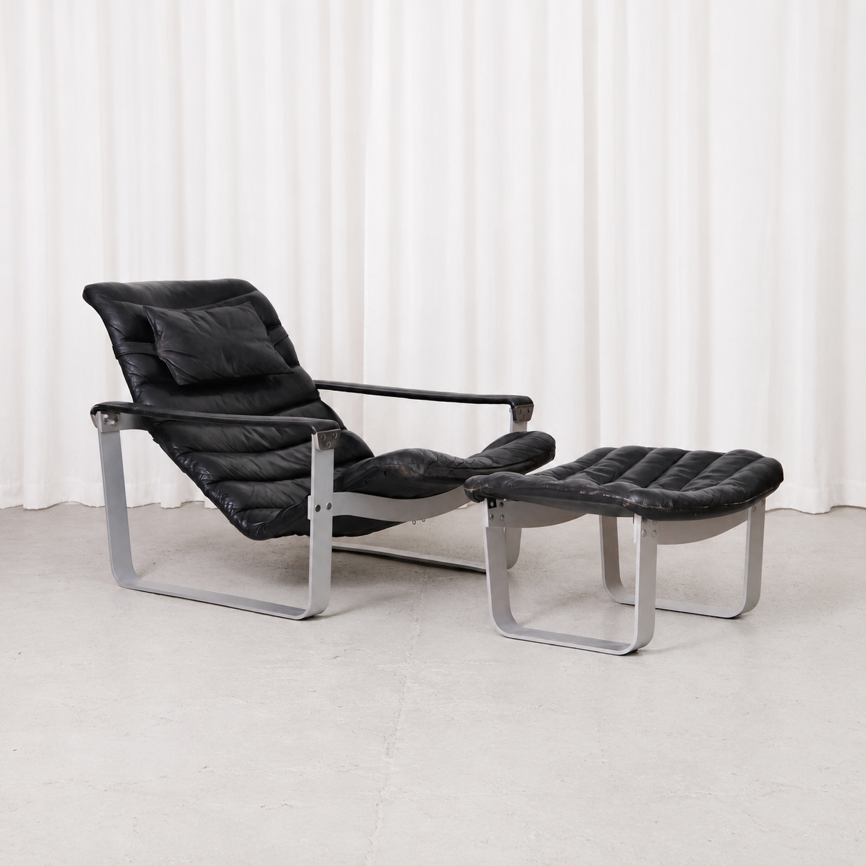 Ilmari Lappalainen Pulkka Lounge Chair and Ottoman in Black Leather, Asko Export