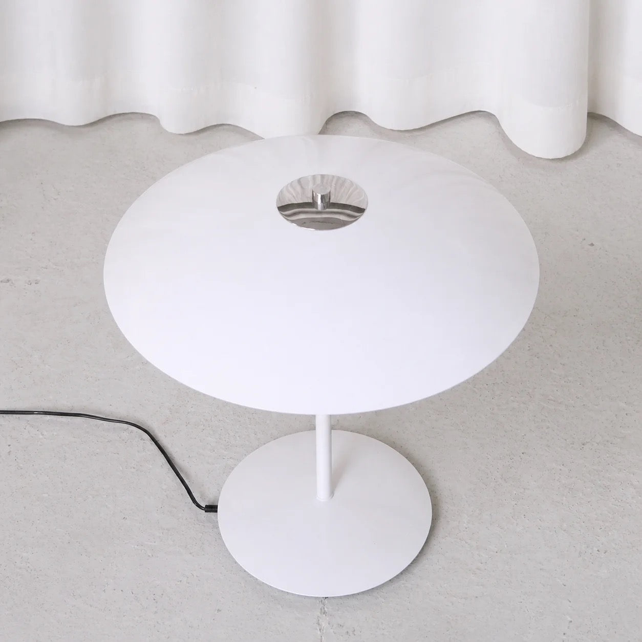 White metal shade of Jonas table lamp viewed from above