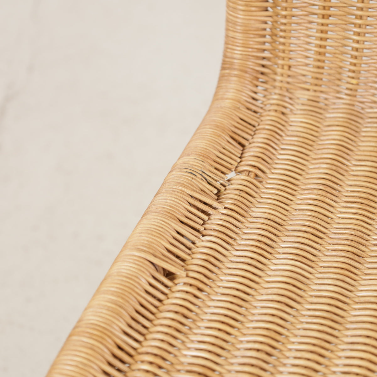 Knoll MR10 rattan chair by Ludwig Mies van der Rohe, detail of damaged cane along the side