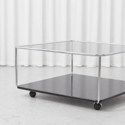 Chrome frame, smoked glass top and black lower shelf of Hannibal coffee table