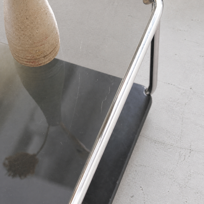 Light scratches visible on the tinted glass top