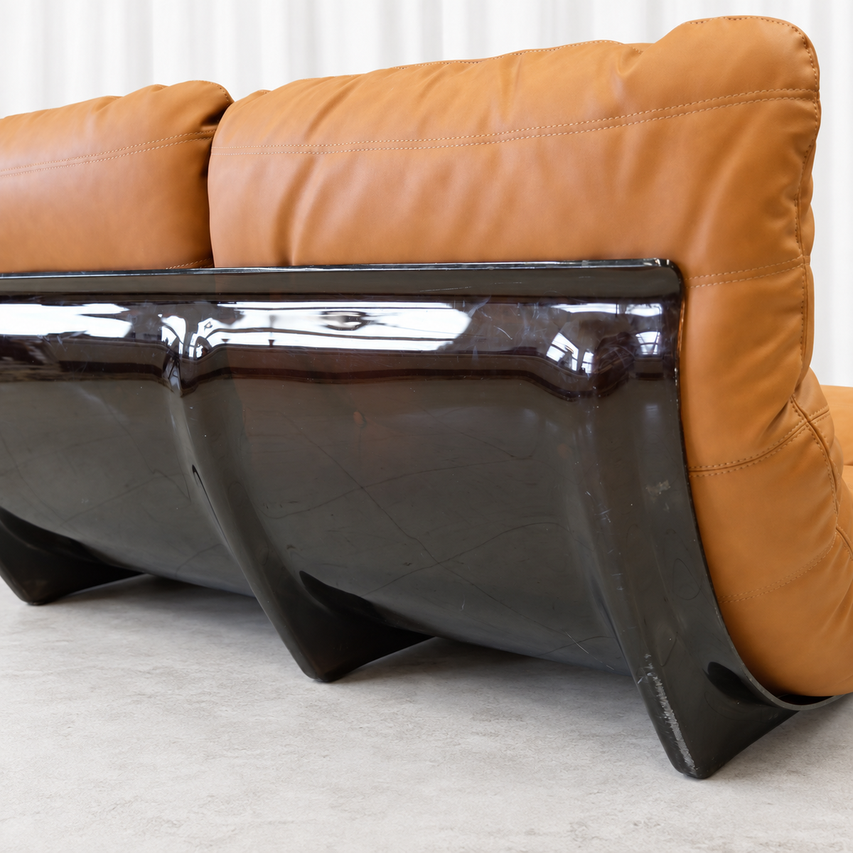 Ligne Roset Marsala sofa smoked acrylic shell and leather upholstery, right detail.