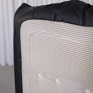 Striped underside fabric and construction detail of the Ligne Roset Togo two-seater sofa.