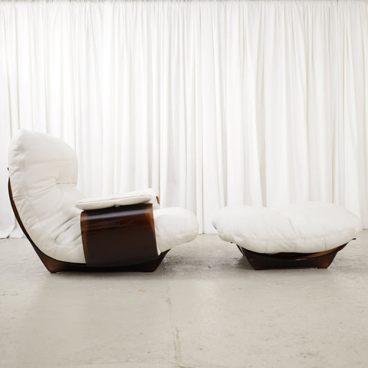 Michel Ducaroy Marsala lounge chair and ottoman for Ligne Roset, side view of white leather and dark curved frames