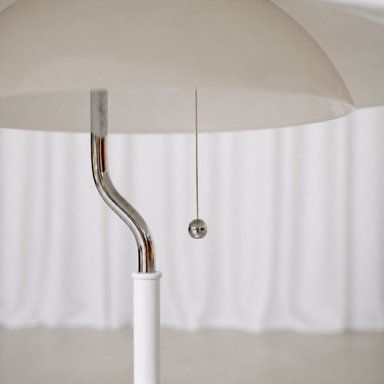 Chrome stem and pull switch detail of the Aurora table lamp by Olle Andersson
