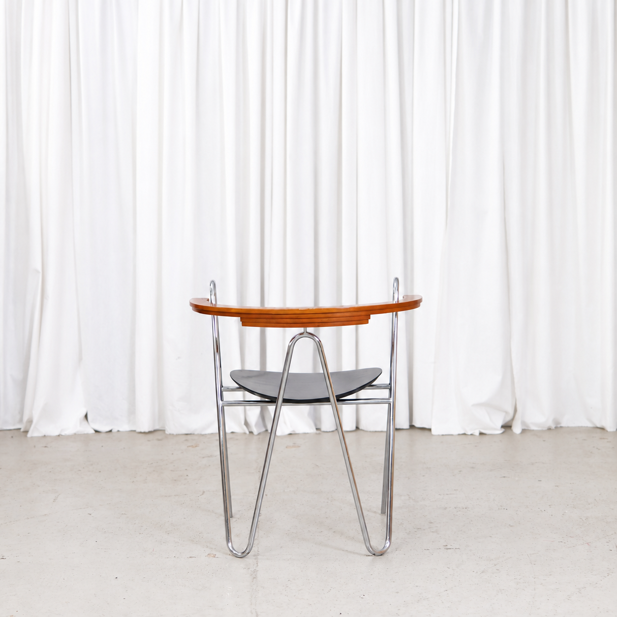 Rear view of Pentti Hakala W chair with laminated wooden backrest
