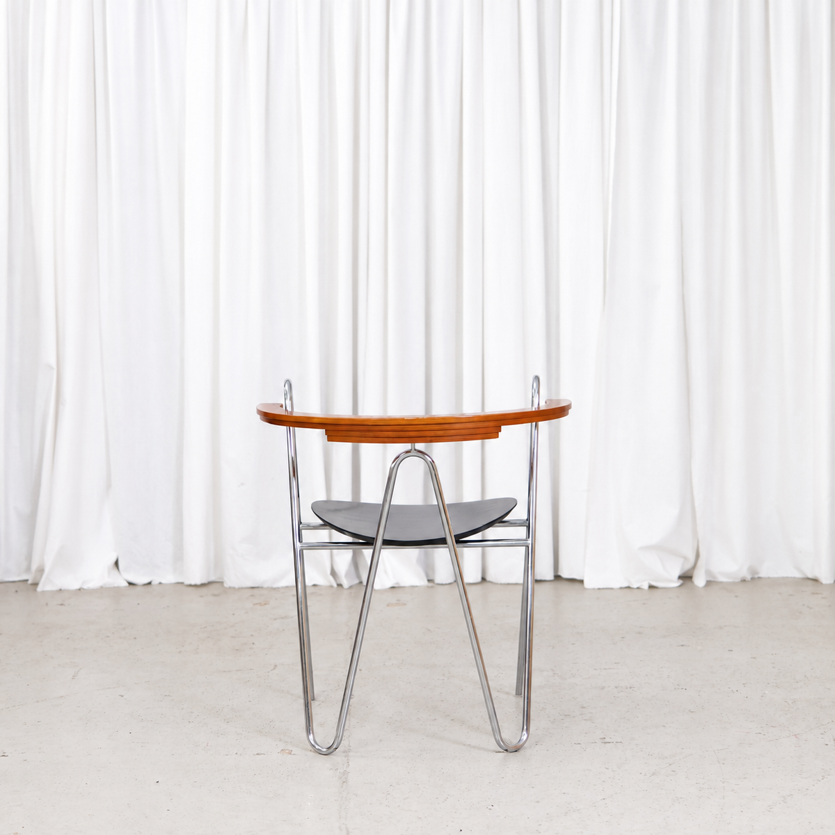 Rear view of Pentti Hakala W chair with laminated wooden backrest