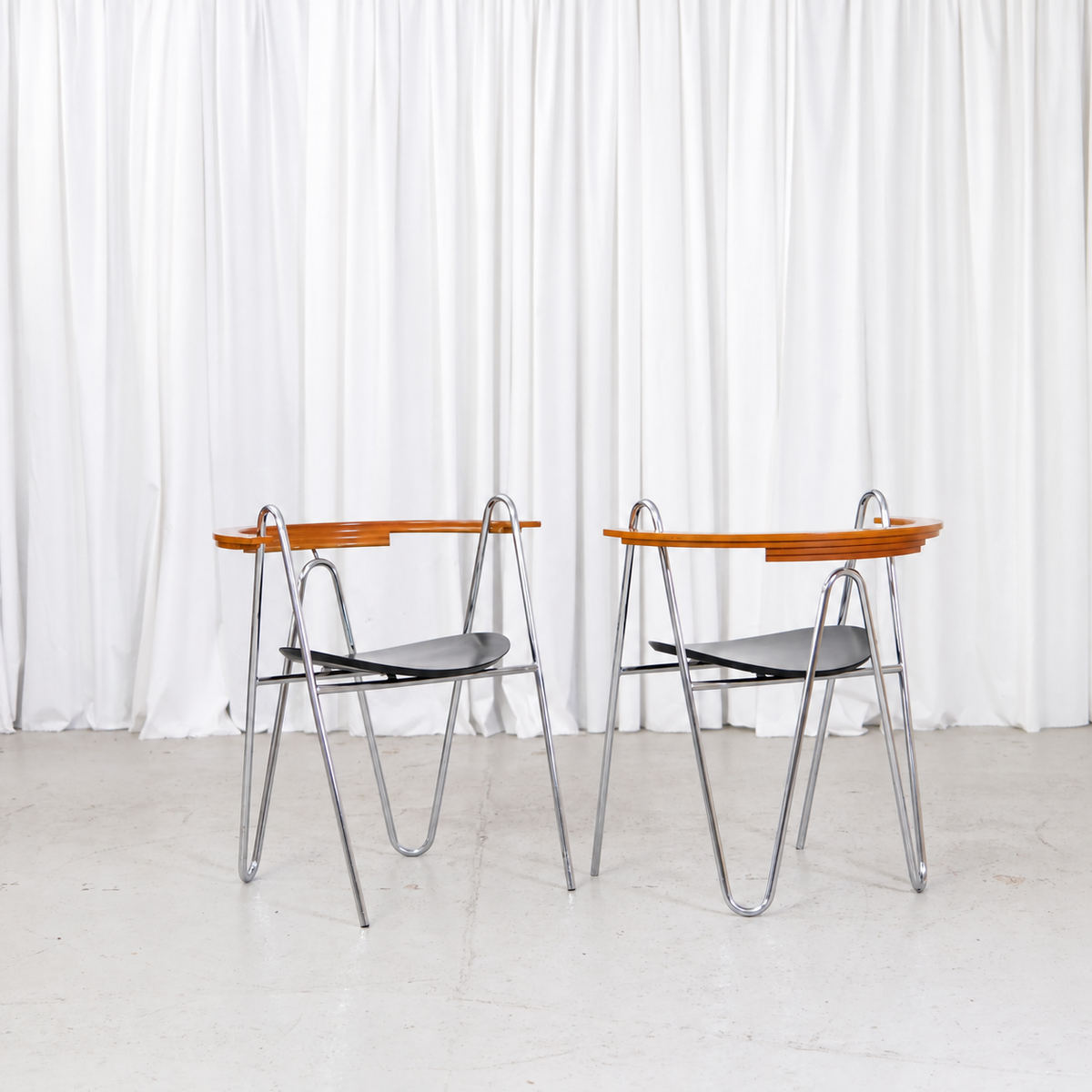 Pair of Pentti Hakala W chairs with chromed frames and black wooden seats