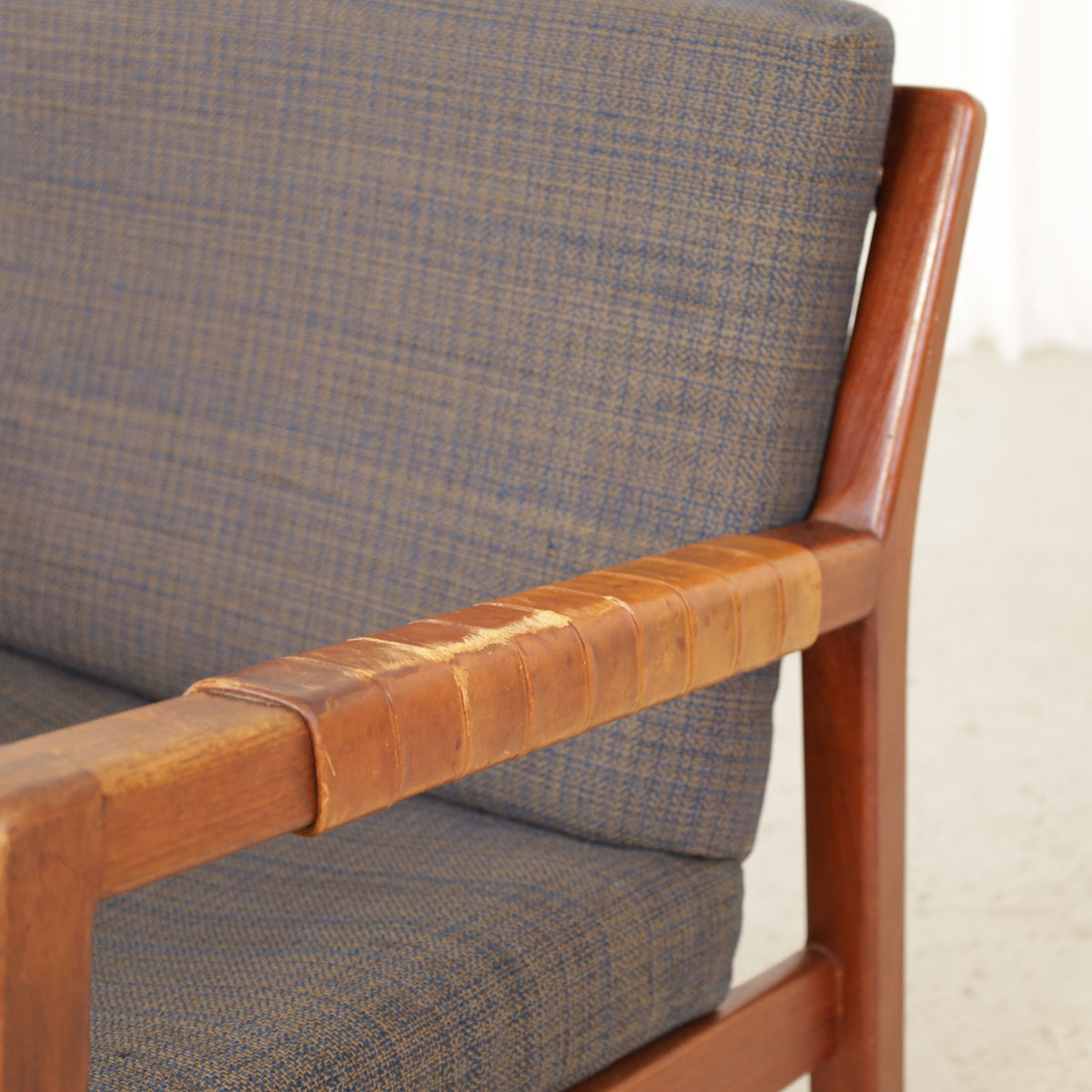 Rialto lounge chair by Carl-Gustaf Hiort af Ornäs, patinated leather, wooden frame and patterned fabric detail