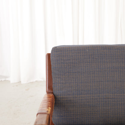 Rialto lounge chair by Carl-Gustaf Hiort af Ornäs, patinated leather, wooden frame and patterned fabric detail