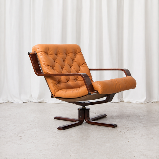 Sigurd Ressell leather and rosewood swivel lounge chair, front angle